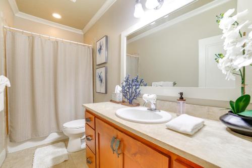 a bathroom with a sink and a toilet at Walk to Poipu Beaches Koloa Condo with Pool Access! in Koloa