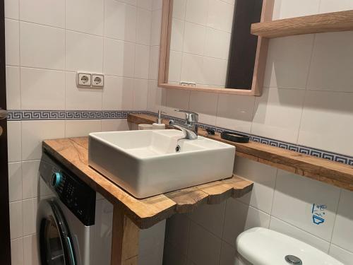 a bathroom with a sink and a toilet at Apartamento en villa bellavista in Almerimar