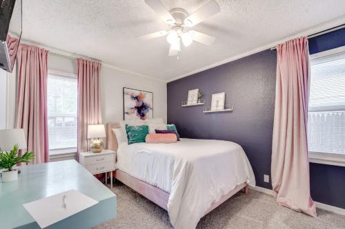 a bedroom with a bed and a ceiling fan at 4 Mi to Dtwn Family Home with Patio in Lubbock in Lubbock