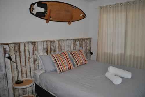 Ένα ή περισσότερα κρεβάτια σε δωμάτιο στο Iluka Beachouse