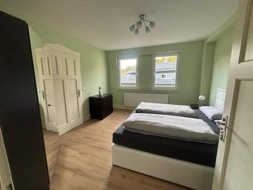 a bedroom with two beds and a window at Felsenblick in Pforzheim