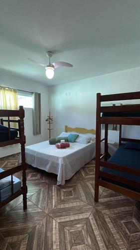 Ένα ή περισσότερα κρεβάτια σε δωμάτιο στο Wonders of Arraial apartamento 8