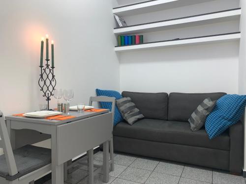 a living room with a couch and a table at Apartment for couples in Hainburg an der Donau