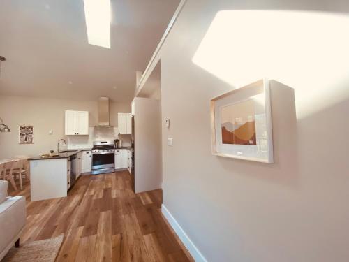 an open kitchen and living room in a apartment at Haven On The Hill in Port Renfrew