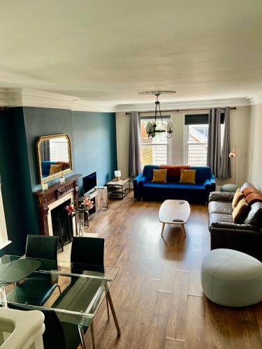 a living room with a couch and a table at Richmond charm cozy apartment in Richmond upon Thames