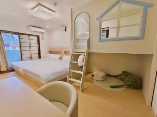 a bedroom with a bunk bed and a ladder to a bunk bed at Rest Collection Bentencho Osaka in Osaka