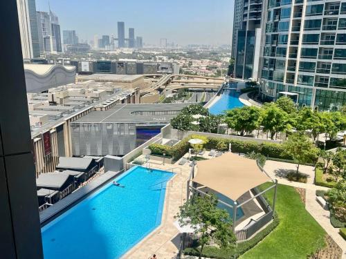 an overhead view of a large swimming pool in a city at Elegant apartment Dubai downtown in Dubai