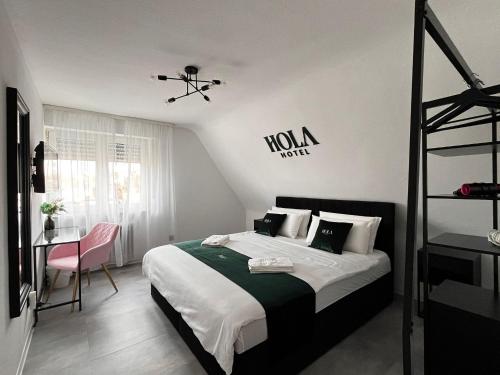 Ένα ή περισσότερα κρεβάτια σε δωμάτιο στο Hola Hotel Stuttgart