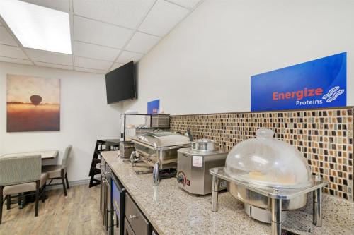 a kitchen with a bunch of food items on a counter at Best Western Brookfield in Brookfield
