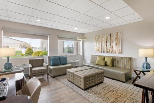 a living room with a couch and chairs at Best Western Brookfield in Brookfield