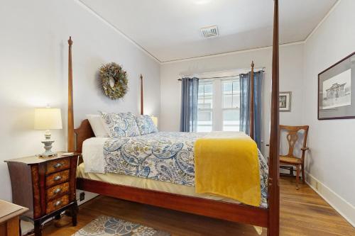 a bedroom with a bed and a window at The Harrison House in Boise