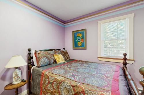 a bedroom with a bed and a window at Blue Lagoon Escape Unit-A in Boothbay