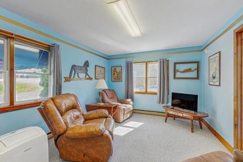 a living room with a couch and a chair at Blue Lagoon Escape Unit-A in Boothbay