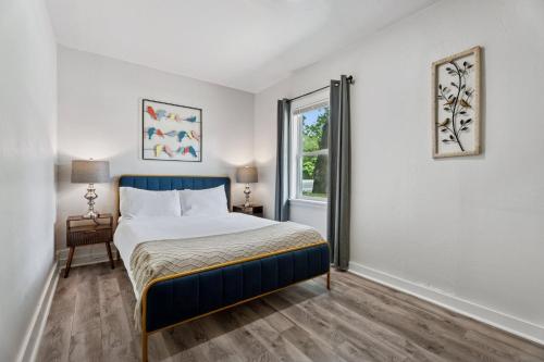 a bedroom with a bed and a window at Affordable 5br Near Route 66 Large Groups #12 in Oklahoma City