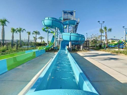 a water slide at a water park at Wonderful Disney-Themed Home in ChampionsGate Resort 15 min from Disney World with 7 pools, Club houses, Water Park, Gym, Arcades, Lazy River, Golf, and More! in Kissimmee