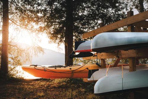 a group of kayaks sitting on top of a table at Suite with mountains view & Resort access in Lac-Superieur