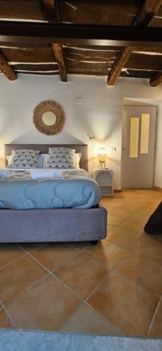 a bedroom with a bed in a room at OIKOS Guesthouse & Rooftop in Suio