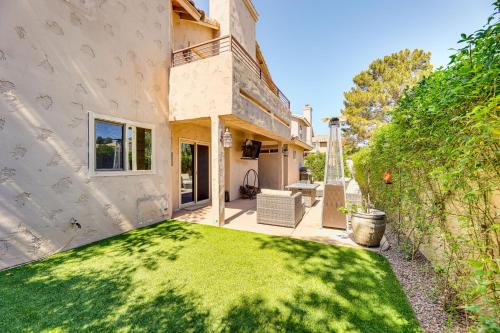 a backyard with a yard of green grass at Val Vista Lakes Group Getaway Lake and Pool Access! in Gilbert