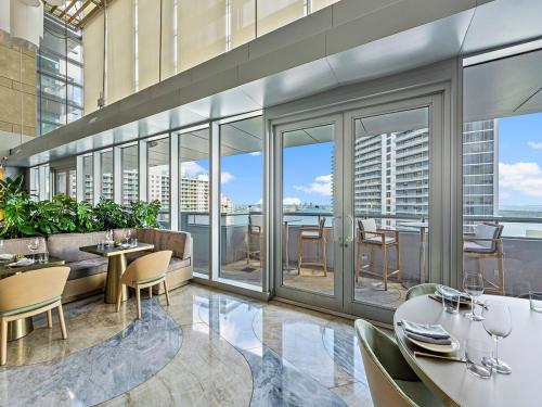 a dining room with a view of a building at Amazing Miami Condo in Brickell near the beach in Miami