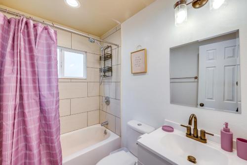 a bathroom with a pink shower curtain and a sink at 2 Mi to Trails Modern Mountain Condo in Big Bear in Big Bear City