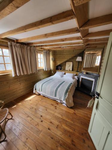 Postel nebo postele na pokoji v ubytování Maison d'Hôtes L'Intemporelle