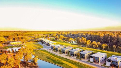 an aerial view of a campus with trees and buildings at Perricoota Waters - Echuca Holiday Homes in Moama
