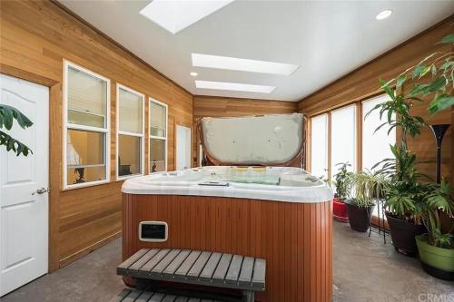 a jacuzzi tub in a room with plants at El Tranquillo in Templeton