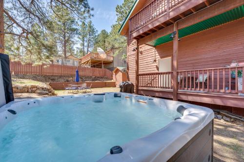 a hot tub on the side of a house at 2 Mi to Lake Estes Home with Deck and Grill in Estes Park