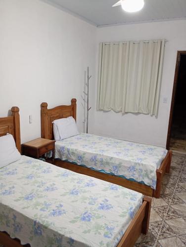 Postel nebo postele na pokoji v ubytování Aconchego do Vale