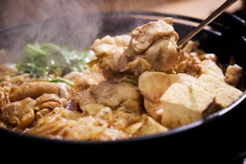 a bowl of food with meat and other foods at KAMENOI HOTEL Nara in Nara