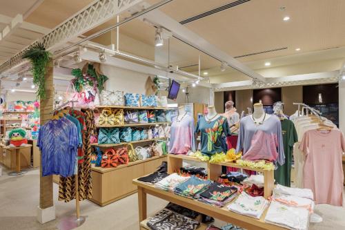 a clothing store with a lot of clothes on display at Spa Resort Hawaiians Monolith Tower in Iwaki