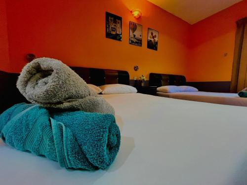Postel nebo postele na pokoji v ubytování Kejora Garden Resort Pulau Pangkor