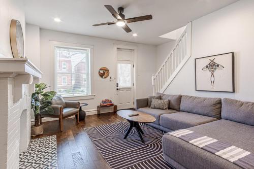 a living room with a couch and a table at Ann Avenue Spacious 3BR Home with Games, Yard and Near Downtown in Saint Louis
