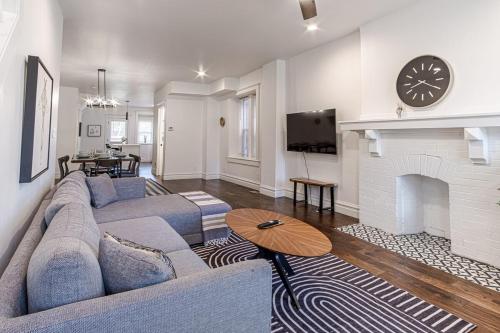 a living room with a couch and a fireplace at Ann Avenue Spacious 3BR Home with Games, Yard and Near Downtown in Saint Louis