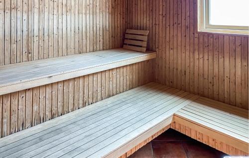 a wooden sauna with a bench in it at 2 Bedroom Beautiful Home In Hok in Hok