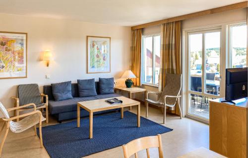 a living room with a couch and a table at 2 Bedroom Beautiful Home In Hok in Hok