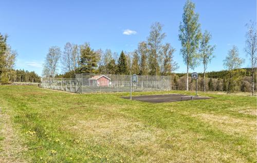a basketball hoop in the middle of a field at 2 Bedroom Awesome Home In Hok in Hok