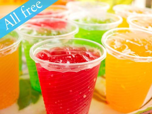 a group of plastic cups filled with different colored drinks at Anshin Oyado Woman&Man Nagoya Sakae in Nagoya