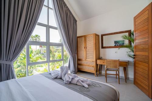 Ένα ή περισσότερα κρεβάτια σε δωμάτιο στο Villa Greenwall Canggu