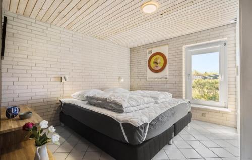 a large bed in a room with a window at Cozy Home In Knebel With Wifi in Knebel
