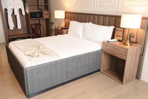 Postel nebo postele na pokoji v ubytování Hotel Savano