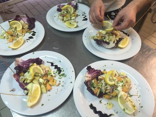 a group of plates of food on a table at Hotel Vela Azzurra in Malcesine