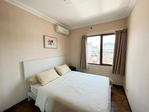Postel nebo postele na pokoji v ubytování 2BR Comfortable City Center