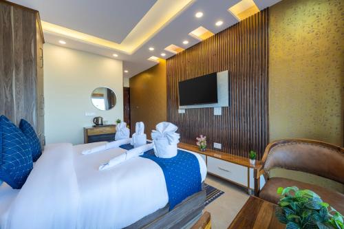 Ένα ή περισσότερα κρεβάτια σε δωμάτιο στο High Rise Inn Kufri