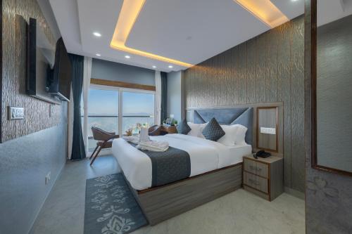 Ένα ή περισσότερα κρεβάτια σε δωμάτιο στο High Rise Inn Kufri