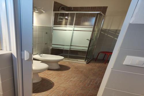 a bathroom with a shower and a toilet and a sink at Apartment in Alcamo near the Beach in Alcamo Marina
