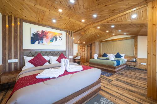 Ένα ή περισσότερα κρεβάτια σε δωμάτιο στο High Rise Inn Kufri