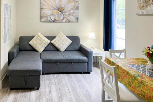 a living room with a couch and a table at Sunny Isles Apartments by MiaRentals in Sunny Isles Beach