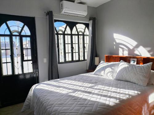 Ένα ή περισσότερα κρεβάτια σε δωμάτιο στο Casa en Villas Universidad Confort