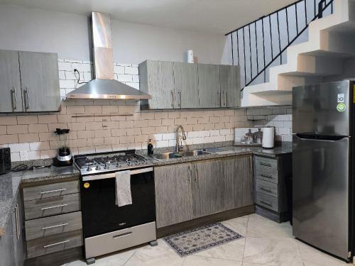 Η κουζίνα ή μικρή κουζίνα στο Casa en Villas Universidad Confort